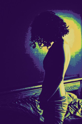Backlit_woman_on_bed.jpg