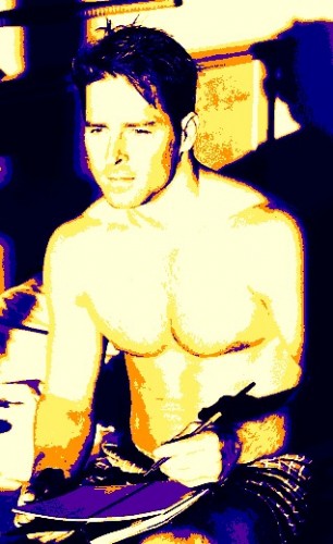Shirtless-man-in-bed-with-pen-and-notebook.jpg